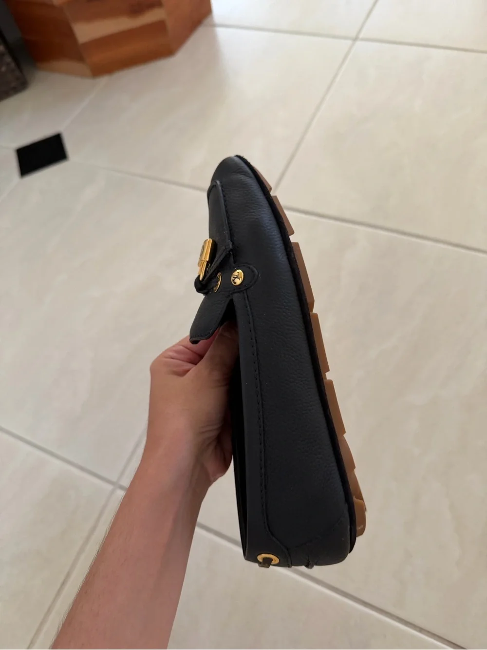 Louis Vuitton Black Leather Loafers with Gold Accent Hardware